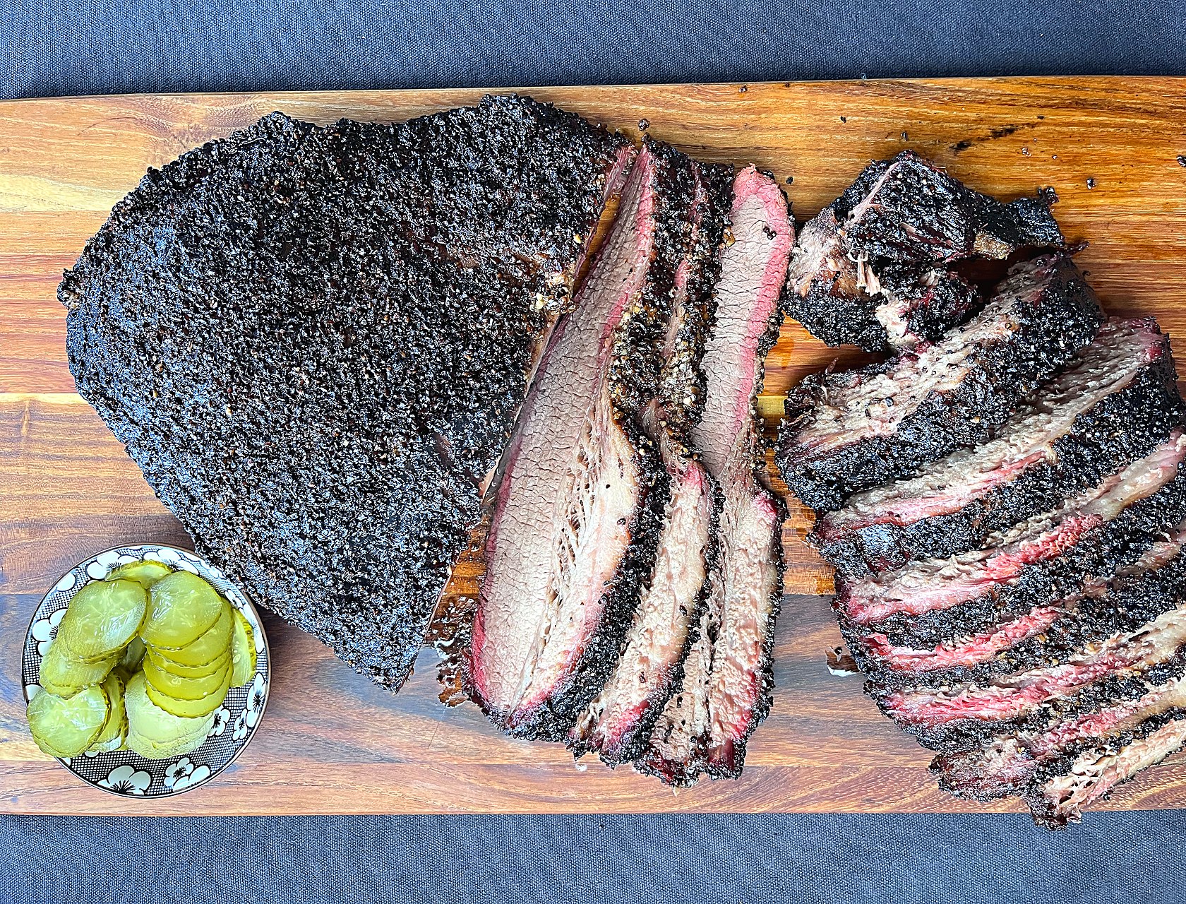 Sliced 14-hour smoked brisket, dark bark and pink smoke ring